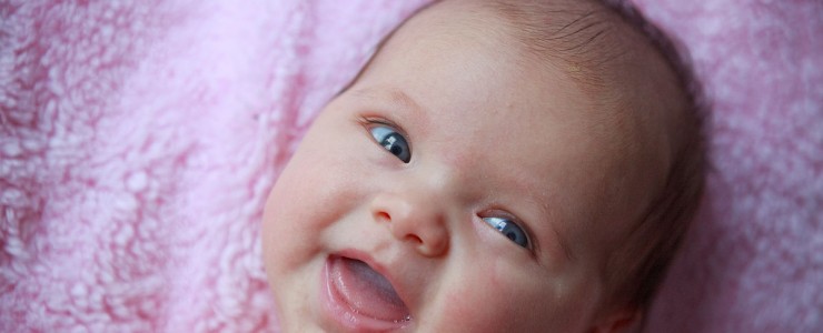 "A smiling baby" by Kenny Louie from Vancouver, Canada. Uploaded by russavia. Licensed under CC BY 2.0 via Wikimedia Commons - http://commons.wikimedia.org/wiki/File:A_smiling_baby.jpg#/media/File:A_smiling_baby.jpg